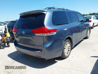 2014 Toyota Sienna XLE with VIN 5TDYK3DC5ES481399, listed as a IAAI auction lot 42085550 with 154,157 mi miles. Bid and sale history available at carsss.com. Image 4.