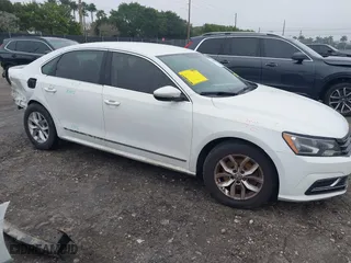 2017 Volkswagen Passat 1.8T S with VIN 1VWAT7A30HC031821, listed as a IAAI auction lot 41409110 with 106,199 mi miles. Bid and sale history available at carsss.com. Image 1.