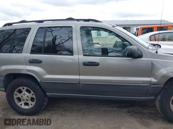 2001 Jeep Grand Cherokee Laredo z VIN 1J4GW48S01C658017, wystawiony jako IAAI lot #42160310 z przebiegiem 220 309 mil mil oraz . Historia ofert i sprzedaży dostępna na DreamBid. Obrazek 14.