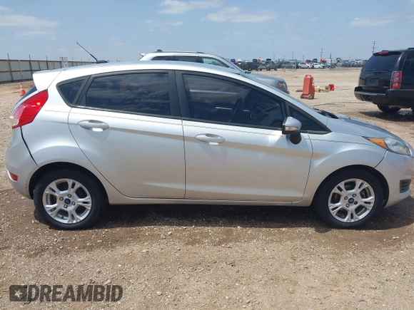 2014 Ford Fiesta SE with VIN 3FADP4EJ4EM151911, listed as a IAAI auction lot 42096321 with 129,938 mi miles and . Bid and sale history available at DreamBid. Image 14.