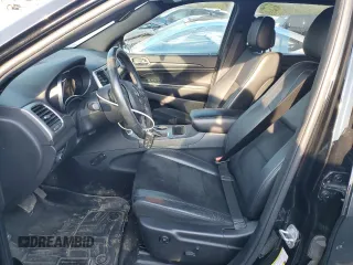 2018 Jeep Grand Cherokee Laredo E with VIN 1C4RJFAG9JC390597, listed as a Copart auction lot 71450474 with 69,645 mi miles and Salvage title. Bid and sale history available at DreamBid. Image 7.