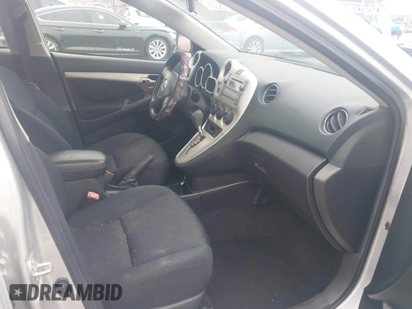 2009 Toyota Matrix with VIN 2T1KU40E49C130897, listed as a IAAI auction lot 42164096 with 140,273 mi miles. Bid and sale history available at carsss.com. Image 5.