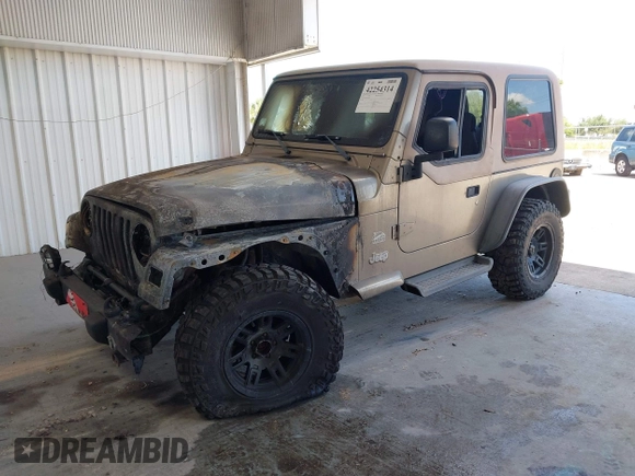 2003 Jeep Wrangler Sahara z VIN 1J4FA59S63P336928, wystawiony jako IAAI lot #42254314 z przebiegiem Nie podano mil oraz . Historia ofert i sprzedaży dostępna na DreamBid. Obrazek 2.