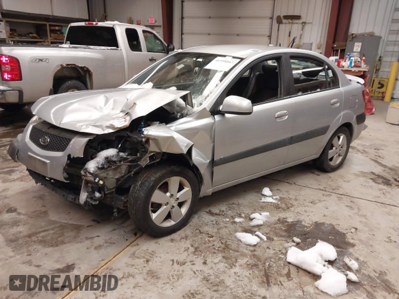 2009 Kia Rio LX with VIN KNADE223596444133, listed as a IAAI auction lot 41598865 with Not Provided miles and . Bid and sale history available at DreamBid. Image 2.