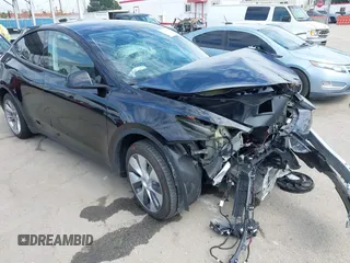 2023 Tesla Model Y Long Range z VIN 7SAYGDEE2PF863200, wystawiony jako IAAI lot #41805168 z przebiegiem 25 480 mil mil oraz . Historia ofert i sprzedaży dostępna na DreamBid. Obrazek 1.