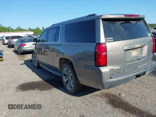 2019 Chevrolet Suburban LT with VIN 1GNSCJKC3KR129739, listed as a IAAI auction lot 42044708 with 105,771 mi miles and . Bid and sale history available at DreamBid. Image 3.