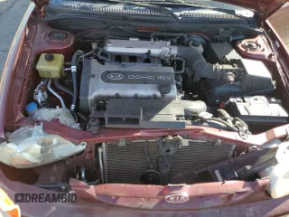 2001 Kia Sephia z VIN KNAFB121015028494, wystawiony jako Copart lot #81581404 z przebiegiem 86 655 mil mil oraz Szkody całkowita. Historia ofert i sprzedaży dostępna na DreamBid. Obrazek 12.