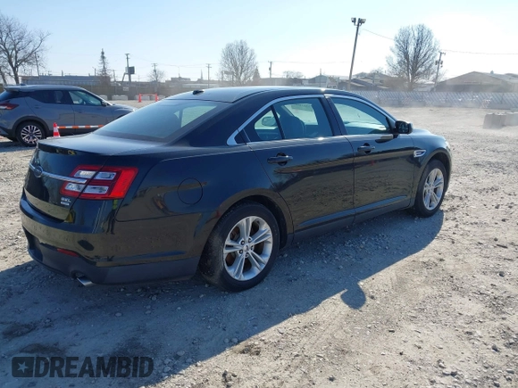 2013 Ford Taurus SEL with VIN 1FAHP2E96DG148836, listed as a IAAI auction lot 42030387 with 192,218 mi miles and . Bid and sale history available at carsss.com. Image 4.