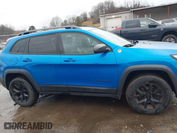 2018 Jeep Cherokee Trailhawk with VIN 1C4PJMBX3JD512813, listed as a IAAI auction lot 41457312 with 125,644 mi miles. Bid and sale history available at carsss.com. Image 14.