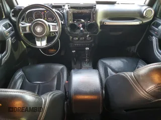 2015 Jeep Wrangler Unlimited Rubicon Hard Rock with VIN 1C4HJWFGXFL671660, listed as a Copart auction lot 82329074 with 214,579 mi miles and Salvage title. Bid and sale history available at DreamBid. Image 8.