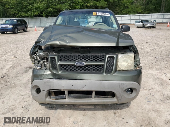 2003 Ford Explorer Sport XLS z VIN 1FMYU60E03UC12105, wystawiony jako Copart lot #67044604 z przebiegiem 277 642 mil mil oraz Szkody całkowita. Historia ofert i sprzedaży dostępna na DreamBid. Obrazek 5.