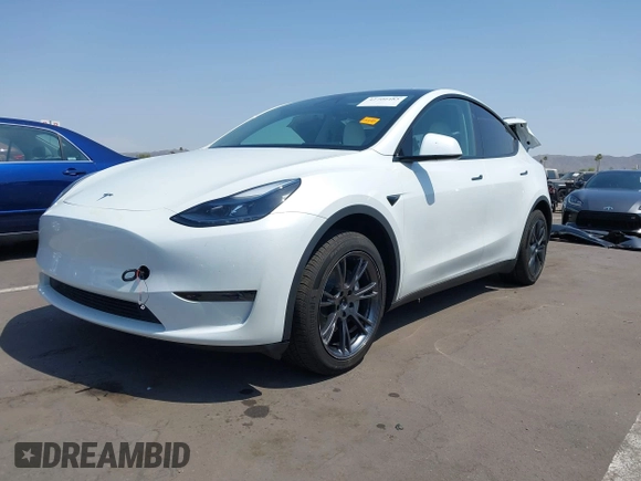 2024 Tesla Model Y with VIN 7SAYGDED8RF201955, listed as a IAAI auction lot 42700483 with 11,898 mi miles and . Bid and sale history available at DreamBid. Image 2.