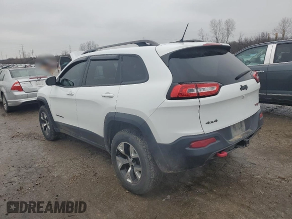 2015 Jeep Cherokee Trailhawk z VIN 1C4PJMBS9FW698857, wystawiony jako Copart lot #86572504 z przebiegiem 143 919 mil mil oraz Czysty tytuł • Clean title. Historia ofert i sprzedaży dostępna na DreamBid. Obrazek 2.