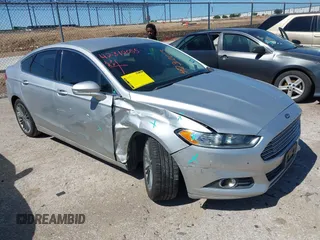 2015 Ford Fusion SE z VIN 3FA6P0H94FR205344, wystawiony jako IAAI lot #42310055 z przebiegiem 107 637 mil mil oraz . Historia ofert i sprzedaży dostępna na DreamBid. Obrazek 1.