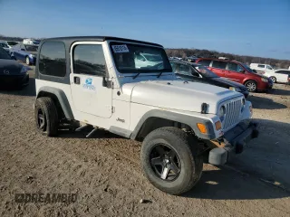 2004 Jeep Wrangler Sport Right Hand Drive with VIN 1J4F449S54P775671, listed as a Copart auction lot 85610114 with 199,074 mi miles and Salvage Title. Bid and sale history available at carsss.com. Image 4.