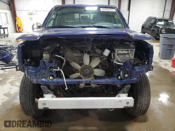 2015 Toyota Tacoma with VIN 3TMLU4EN6FM186016, listed as a Copart auction lot 58404675 with 127,536 mi miles and Salvage title. Bid and sale history available at DreamBid. Image 5.