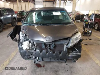 2015 Toyota Sienna L with VIN 5TDZK3DCXFS567507, listed as a IAAI auction lot 41205670 with 104,443 mi miles and . Bid and sale history available at DreamBid. Image 6.