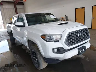 2021 Toyota Tacoma SR with VIN 5TFCZ5AN0MX256078, listed as a IAAI auction lot 42576632 with 53,529 mi miles and . Bid and sale history available at DreamBid. Image 1.