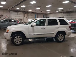 2009 Jeep Grand Cherokee Limited with VIN 1J8GR58K29C553812, listed as a IAAI auction lot 41520065 with 203,595 mi miles. Bid and sale history available at carsss.com. Image 12.
