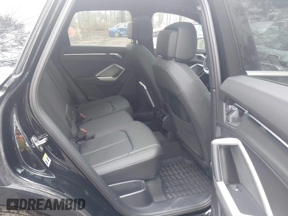 2021 Audi Q3 Premium with VIN WA1AUCF34M1148531, listed as a IAAI auction lot 41815286 with 31,934 mi miles and . Bid and sale history available at DreamBid. Image 8.