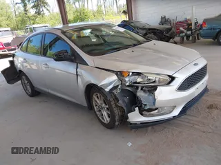 2016 Ford Focus SE z VIN 1FADP3F27GL338923, wystawiony jako IAAI lot #42354817 z przebiegiem 76 912 mil mil oraz . Historia ofert i sprzedaży dostępna na DreamBid. Obrazek 1.