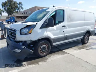 2020 Ford Transit Cargo with VIN 1FTBR1Y80LKA67205, listed as a IAAI auction lot 41805459 with 184,186 mi miles and . Bid and sale history available at DreamBid. Image 2.