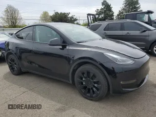 2023 Tesla Model Y Long Range z VIN 7SAYGDEE0PF869710, wystawiony jako Copart lot #52885365 z przebiegiem 13 919 mil mil oraz Szkoda całkowita • Salvage title. Historia ofert i sprzedaży dostępna na DreamBid. Obrazek 4.
