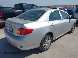 2009 Toyota Corolla with VIN 1NXBU40E79Z134599, listed as a IAAI auction lot 42035077 with 154,051 mi miles. Bid and sale history available at carsss.com. Image 4.