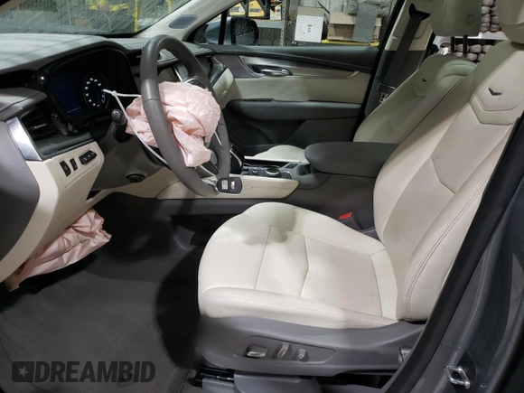 2023 Cadillac XT5 AWD Premium Luxury with VIN 1GYKNDRS5PZ221261, listed as a Copart auction lot 52779565 with 7,098 mi miles and Salvage Title. Bid and sale history available at DreamBid. Image 7.