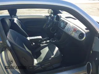 2013 Volkswagen Beetle 2.5L w/Sun/Sound/Nav with VIN 3VWJX7AT3DM663774, listed as a IAAI auction lot 41738146 with 98,064 mi miles and . Bid and sale history available at DreamBid. Image 5.