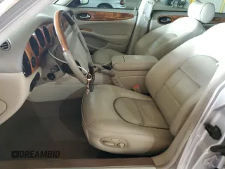 2000 Jaguar XJ with VIN SAJDA25B8YMF04079, listed as a Copart auction lot 50592595 with 131,647 mi miles and Salvage title. Bid and sale history available at DreamBid. Image 7.