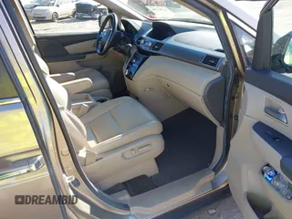 2012 Honda Odyssey EX-L with VIN 5FNRL5H63CB016526, listed as a IAAI auction lot 41701396 with 132,016 mi miles and . Bid and sale history available at carsss.com. Image 5.