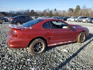 1996 Ford Mustang GT z VIN 1FALP42X0TF168223, wystawiony jako Copart lot #46351085 z przebiegiem 121 657 mil mil oraz Szkoda całkowita • Salvage title. Historia ofert i sprzedaży dostępna na DreamBid. Obrazek 3.