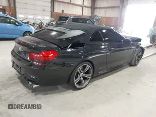 2014 BMW M6 z VIN WBSLZ9C58EDZ78401, wystawiony jako IAAI lot #41840114 z przebiegiem 23 499 mil mil oraz . Historia ofert i sprzedaży dostępna na DreamBid. Obrazek 4.