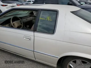 1999 Cadillac Eldorado z VIN 1G6EL12Y7XU615169, wystawiony jako Copart lot #76459744 z przebiegiem Nie podano mil oraz Szkoda całkowita • Salvage title. Historia ofert i sprzedaży dostępna na DreamBid. Obrazek 12.