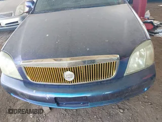 2003 Cadillac DeVille DTS z VIN 1G6KF57943U114611, wystawiony jako IAAI lot #41661350 z przebiegiem 160 762 mil mil oraz . Historia ofert i sprzedaży dostępna na DreamBid. Obrazek 6.