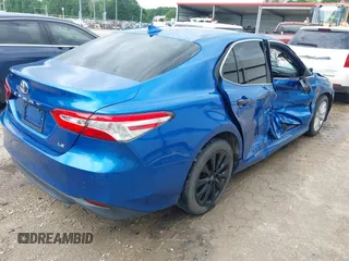 2019 Toyota Camry LE with VIN 4T1B11HK7KU259920, listed as a IAAI auction lot 42115493 with 69,254 mi miles and . Bid and sale history available at DreamBid. Image 4.