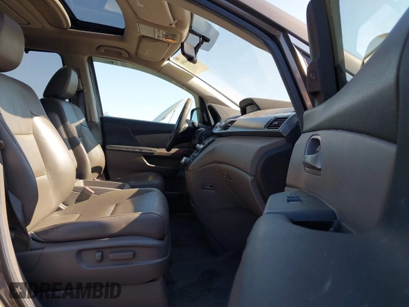 2012 Honda Odyssey Touring with VIN 5FNRL5H95CB057346, listed as a IAAI auction lot 42644094 with 114,712 mi miles and . Bid and sale history available at DreamBid. Image 5.