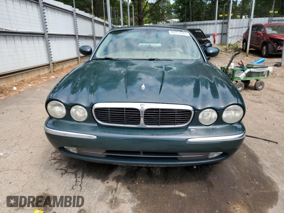 2004 Jaguar XJ with VIN SAJWA71C34SG16508, listed as a Copart auction lot 66751644 with 179,039 mi miles and Salvage Title. Bid and sale history available at carsss.com. Image 5.