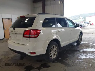 2018 Dodge Journey SXT with VIN 3C4PDDBGXJT469945, listed as a IAAI auction lot 42266310 with 121,871 mi miles and . Bid and sale history available at DreamBid. Image 4.