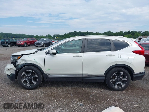 2018 Honda CR-V Touring with VIN 2HKRW2H91JH665241, listed as a IAAI auction lot 42638694 with 62,066 mi miles and . Bid and sale history available at DreamBid. Image 14.