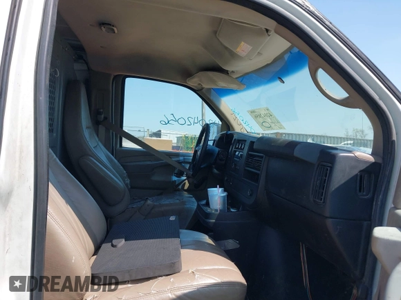 2012 Chevrolet Express Cargo Van with VIN 1GCWGFCA6C1147841, listed as a IAAI auction lot 42042056 with 248,374 mi miles. Bid and sale history available at carsss.com. Image 5.