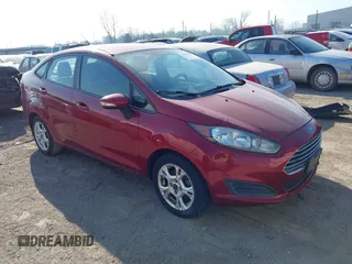 2015 Ford Fiesta SE z VIN 3FADP4BJ6FM100528, wystawiony jako IAAI lot #41894229 z przebiegiem 186 676 mil mil oraz . Historia ofert i sprzedaży dostępna na DreamBid. Obrazek 1.
