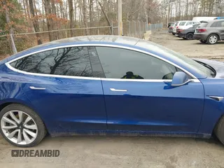 2019 Tesla Model 3 Long Range with VIN 5YJ3E1EB9KF454007, listed as a IAAI auction lot 41769346 with 141,609 mi miles. Bid and sale history available at carsss.com. Image 13.