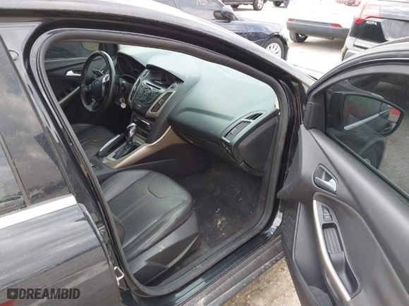 2012 Ford Focus SEL with VIN 1FAHP3H22CL284763, listed as a IAAI auction lot 41824652 with 178,451 mi miles. Bid and sale history available at carsss.com. Image 5.