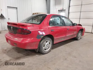 1999 Pontiac Sunfire SE z VIN 1G2JB524XX7547651, wystawiony jako IAAI lot #41962158 z przebiegiem 130 385 mil mil oraz . Historia ofert i sprzedaży dostępna na DreamBid. Obrazek 4.