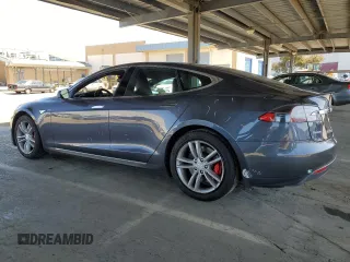 2014 Tesla Model S 60 with VIN 5YJSA1H17EFP63229, listed as a Copart auction lot 51776195 with 156,356 mi miles and Salvage Title. Bid and sale history available at DreamBid. Image 2.