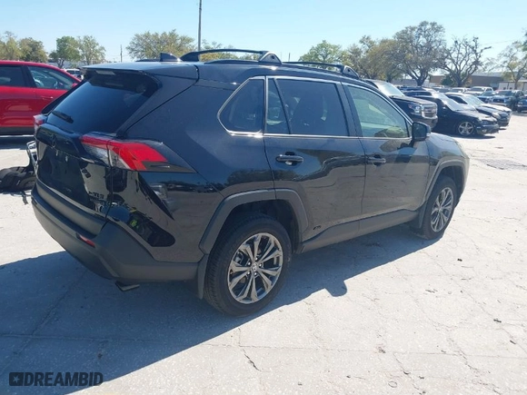2024 Toyota RAV4 Hybrid XLE Premium with VIN JTMB6RFV9RD137409, listed as a IAAI auction lot 41758774 with 5,826 mi miles. Bid and sale history available at carsss.com. Image 4.