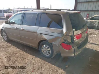 2010 Honda Odyssey EX-L with VIN 5FNRL3H79AB048049, listed as a IAAI auction lot 42055090 with 142,736 mi miles. Bid and sale history available at carsss.com. Image 3.