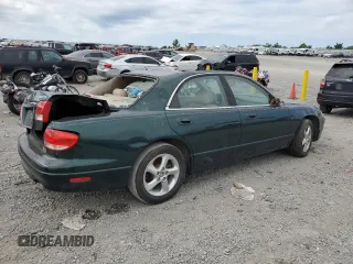 2001 Mazda Millenia z VIN JM1TA221011708952, wystawiony jako Copart lot #64995014 z przebiegiem Nie podano mil oraz Szkody całkowita. Historia ofert i sprzedaży dostępna na DreamBid. Obrazek 3.